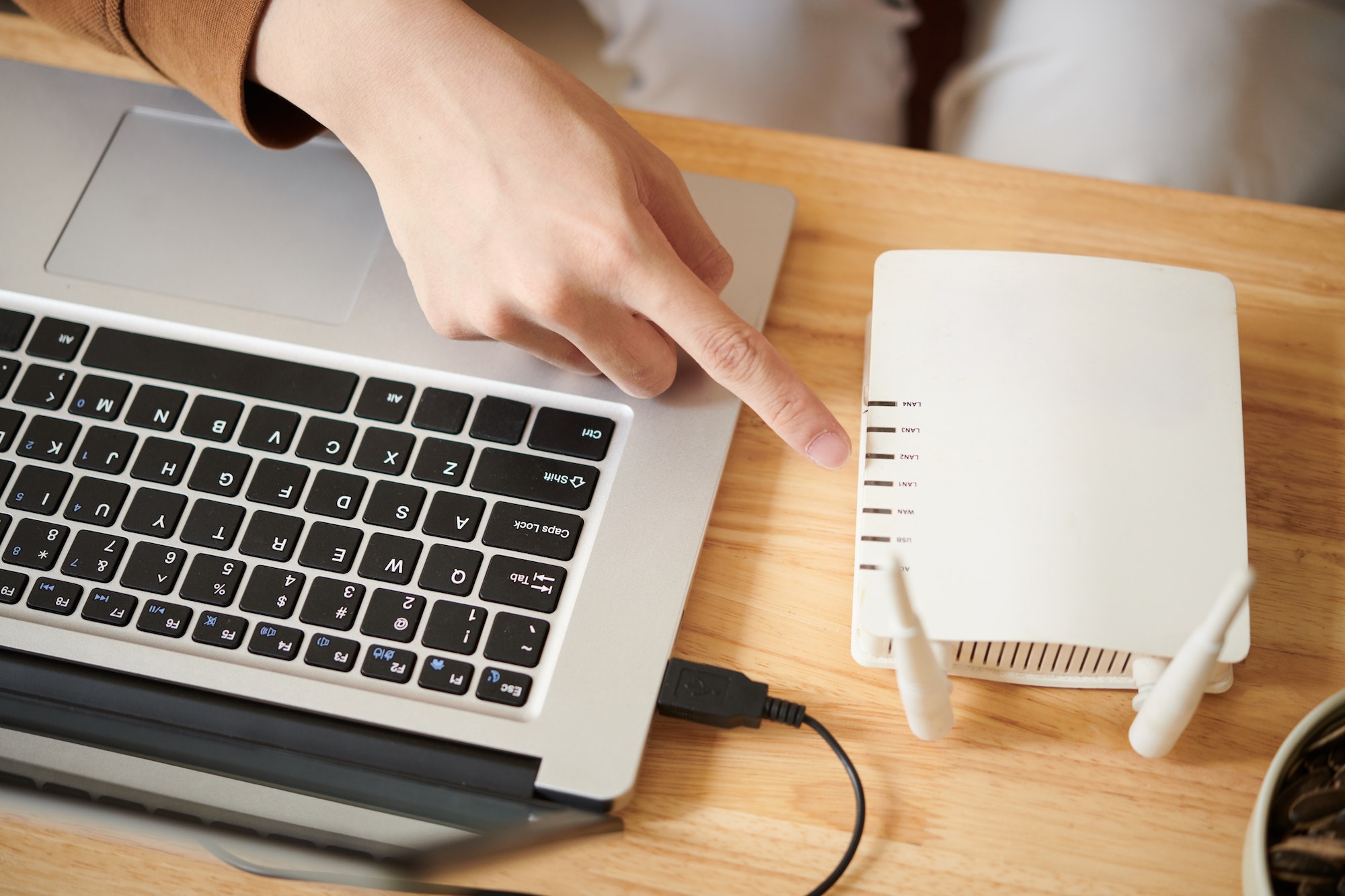 Man Setting up Wi-Fi Router