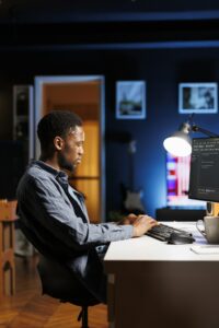 Male programmer working on developing new html script