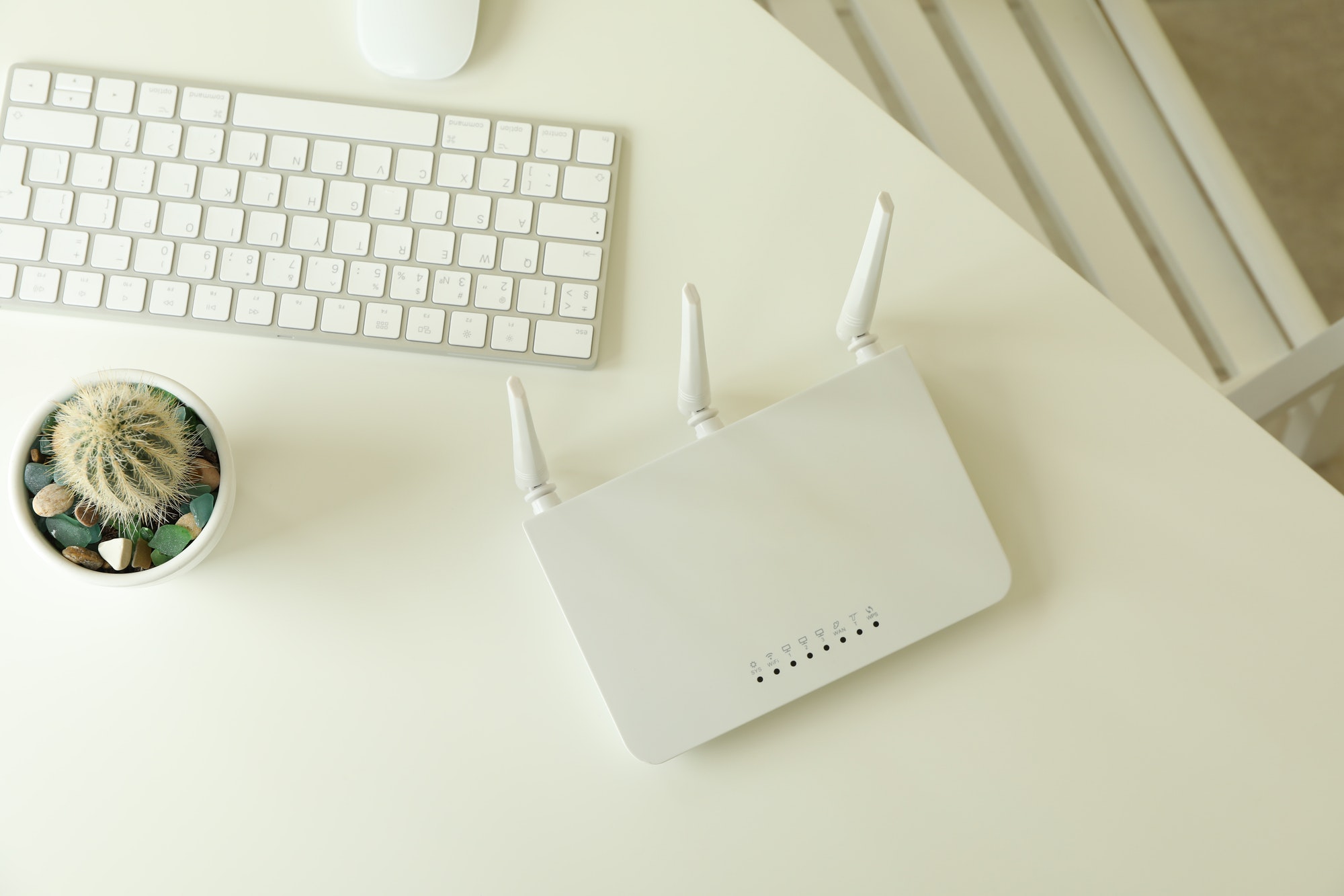 Workplace with Wi - fi router on white table