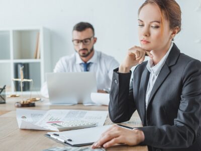 accountants working in office with documents and laptop