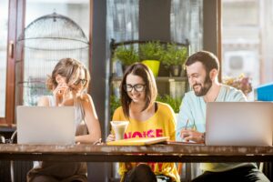 Group of people working together in the cafe
