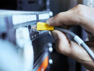 Server, information technology and closeup of computer cable for database transmission by engineer